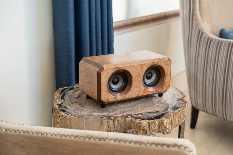 Buy wireless bluetooth speakers with a wooden casings made from reclaimed river wood.